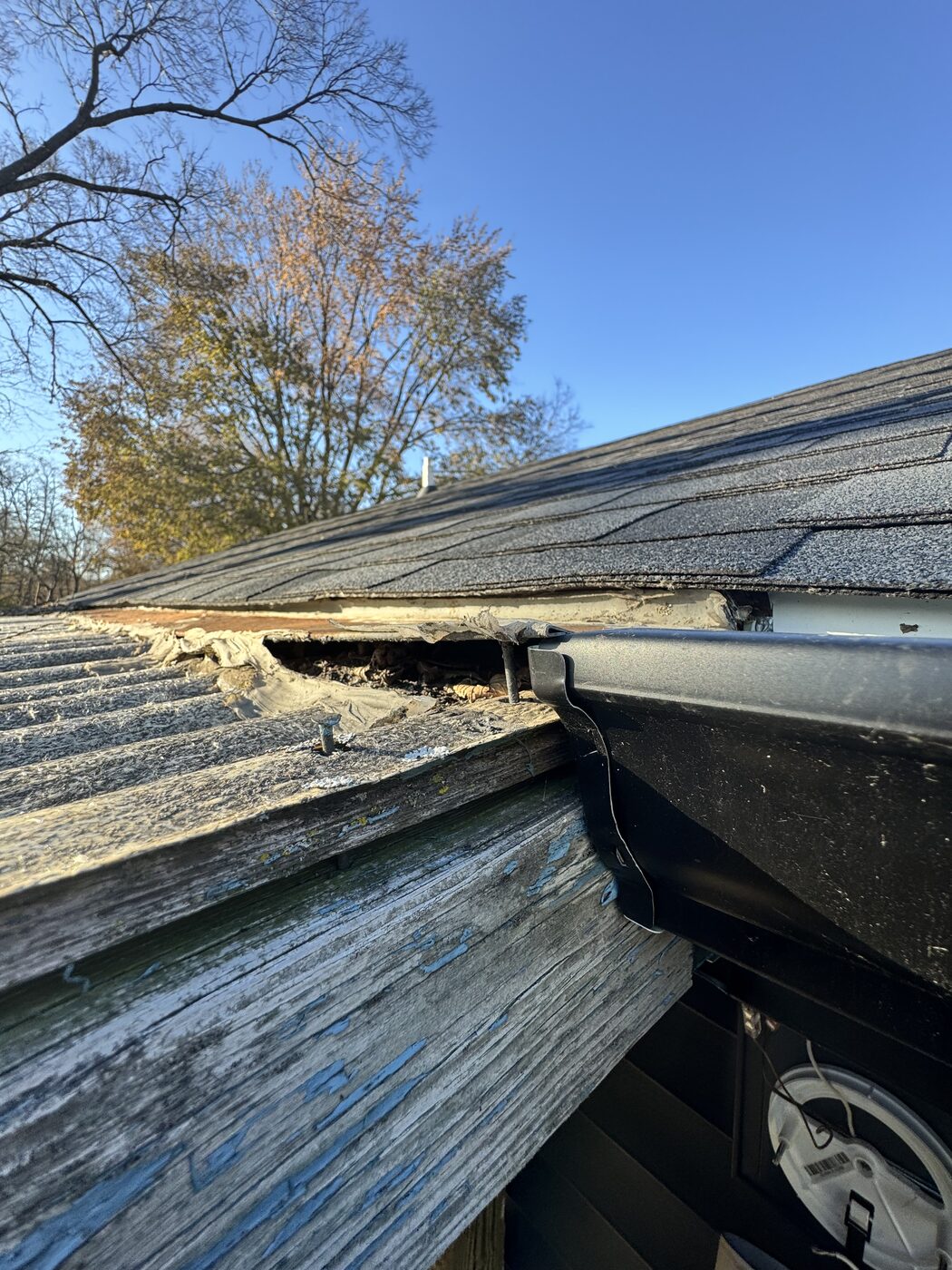 Storm-damaged roof edge and gutter