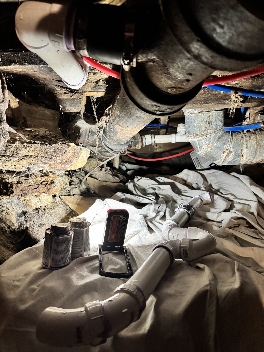 Plumbing leak repair in a crawl space